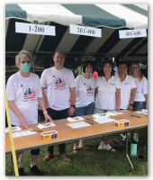 group of bank employees volunteering at road race