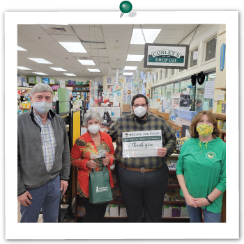 Conley Pharmacy employees receiving gift bags