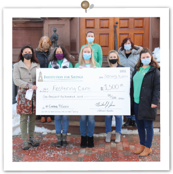 Fostering Care employee receiving check donation