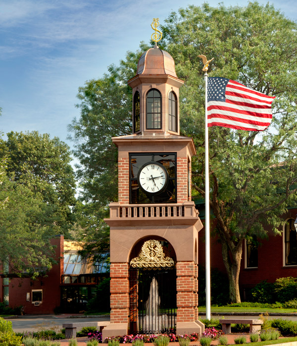 Clocktower with flag outside of Newburyport main office